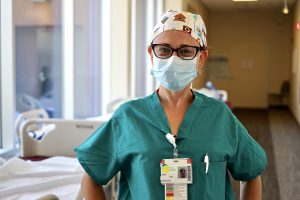 Female healthcare provider posing for a photo