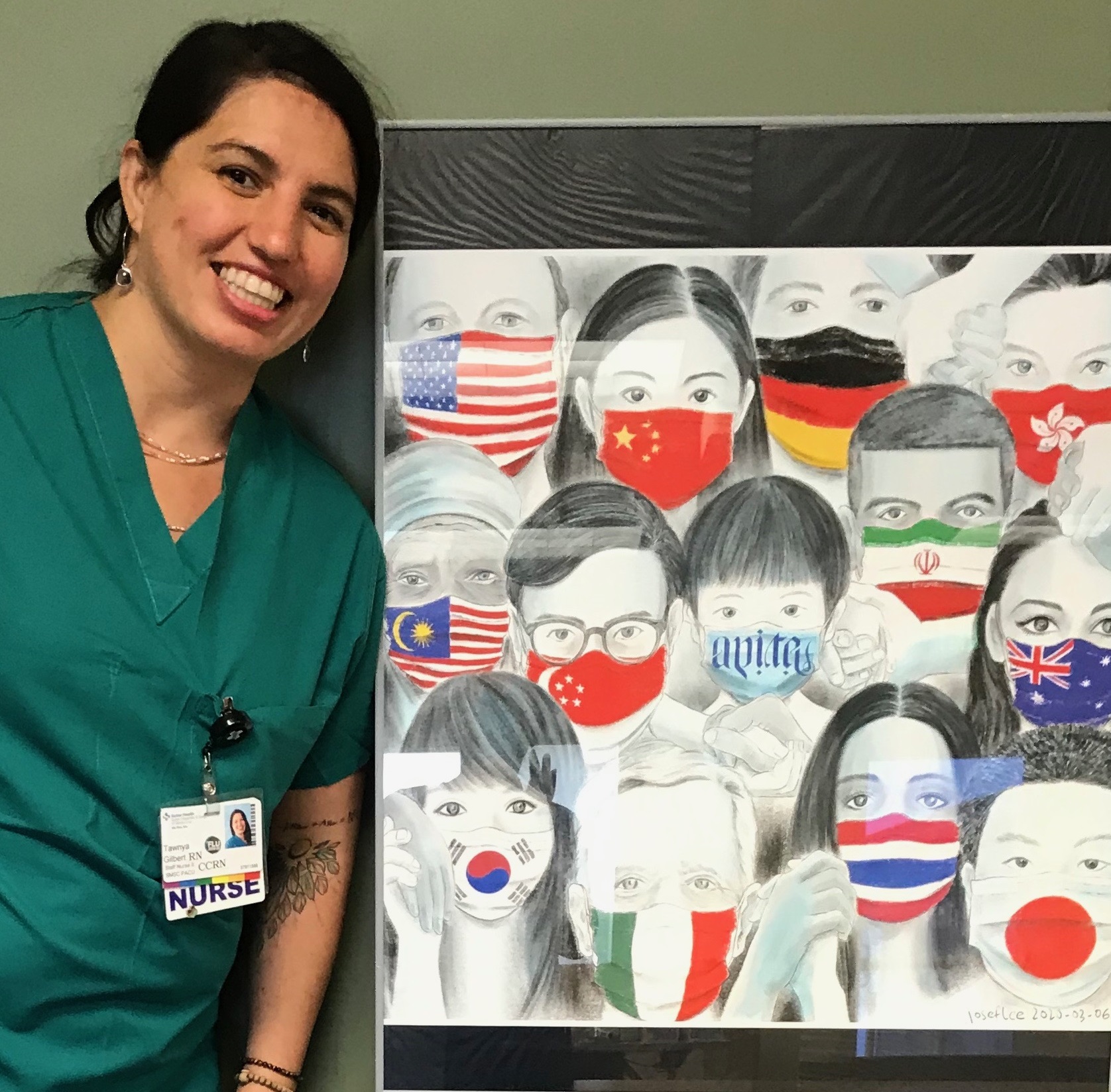 Female nurse poses in front of painting