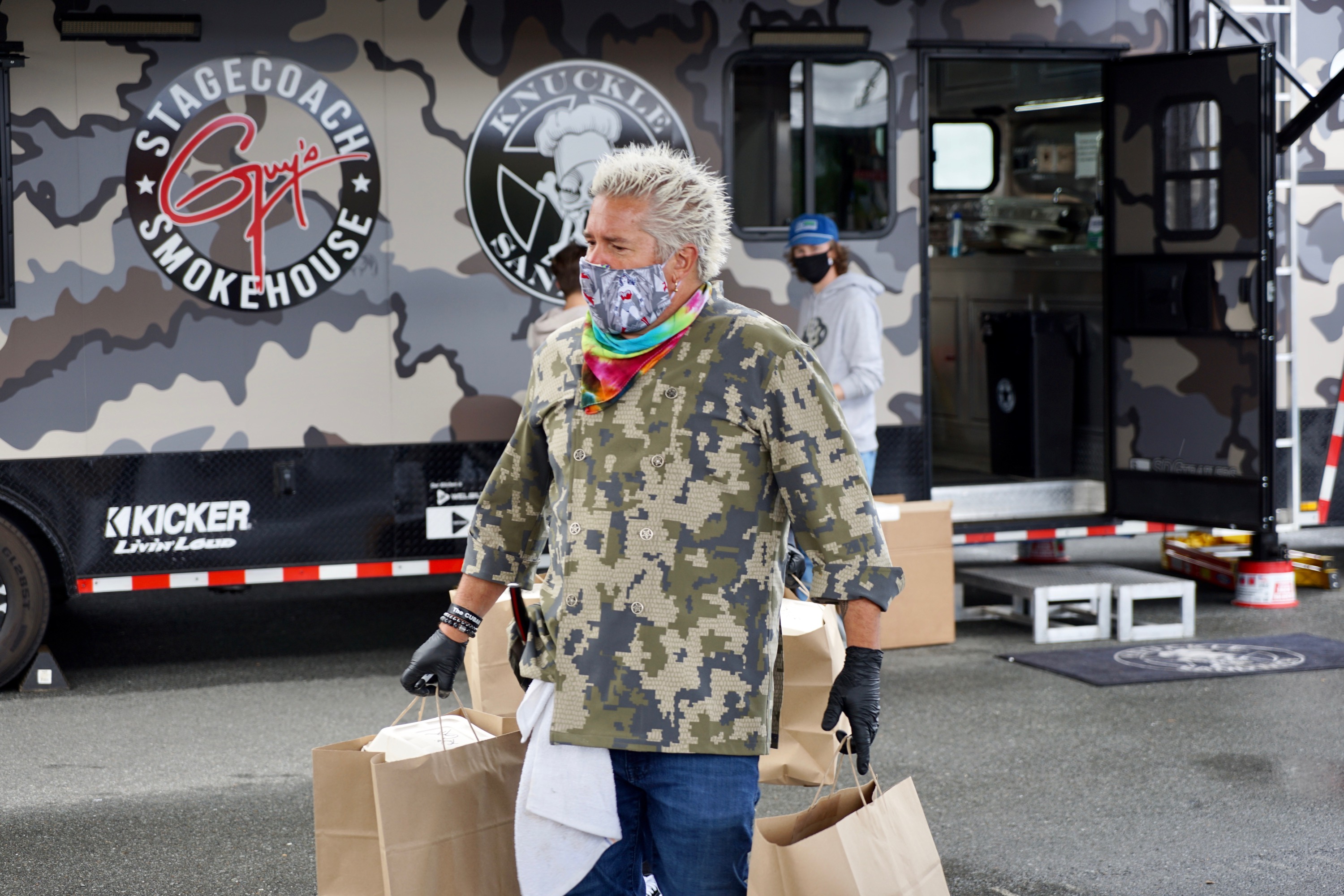 Guy Fieri carries boxes of food for frontline workers at Sutter Santa Rosa