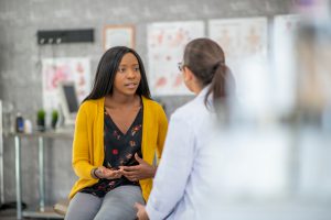 Female doctor has discussion with her patient