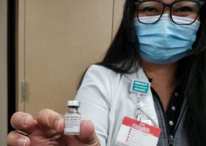 Theresa Nazareno, RN, infection control, Sutter Tracy Community Hospital, holds a vial of the COVID-19 vaccine.
