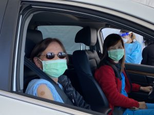Elderly Asian woman with Adult Daughter in Car