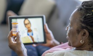 Black Woman on a Video Visit with her doctor