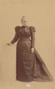 Portrait of Dr. Charlotte Blake Brown standing, wearing long-sleeved gown