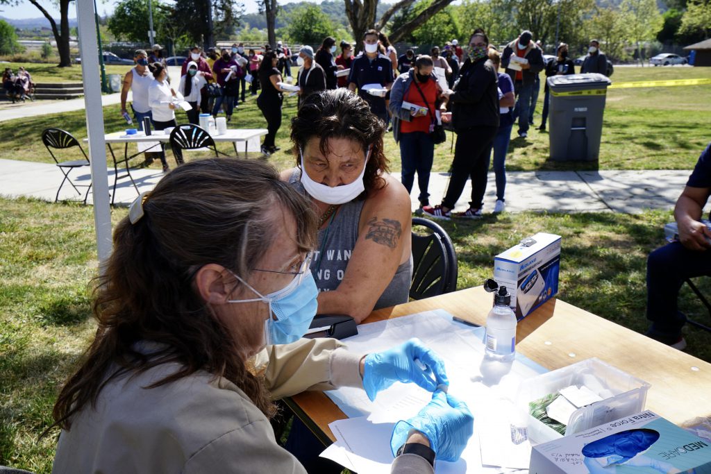 Woman receives her second dose of the COVID-19 vaccine at a pop-up clinic in Santa Rosa