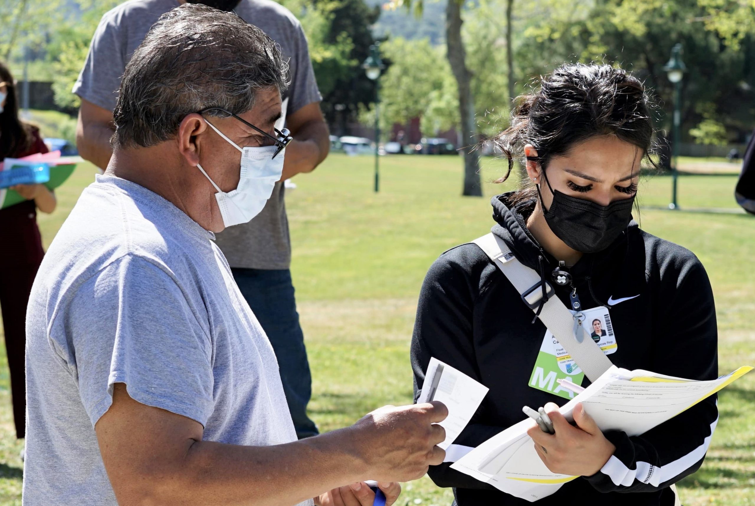 A doctor and Latino community member discuss vaccination