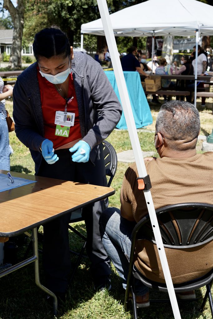 A Latino man gets vaccinated at a pop up clinic in Santa Rosa, California