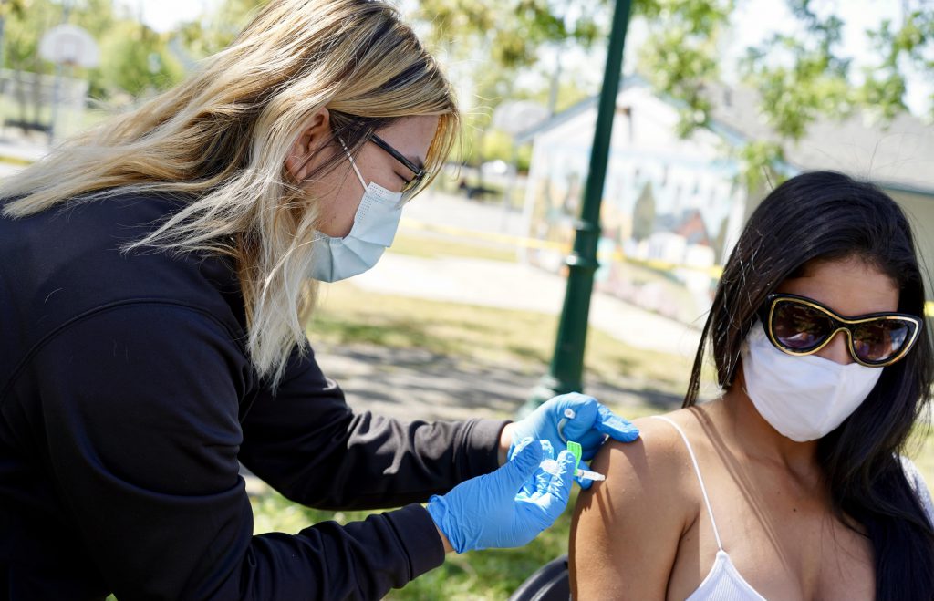 A Latina woman gets vaccinated at a recent pop up clinic in Santa Rosa, California