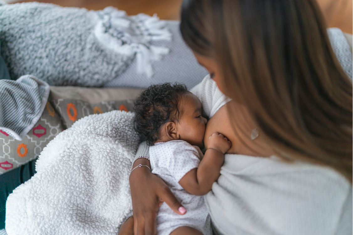Photo of a woman breastfeeding a newborn
