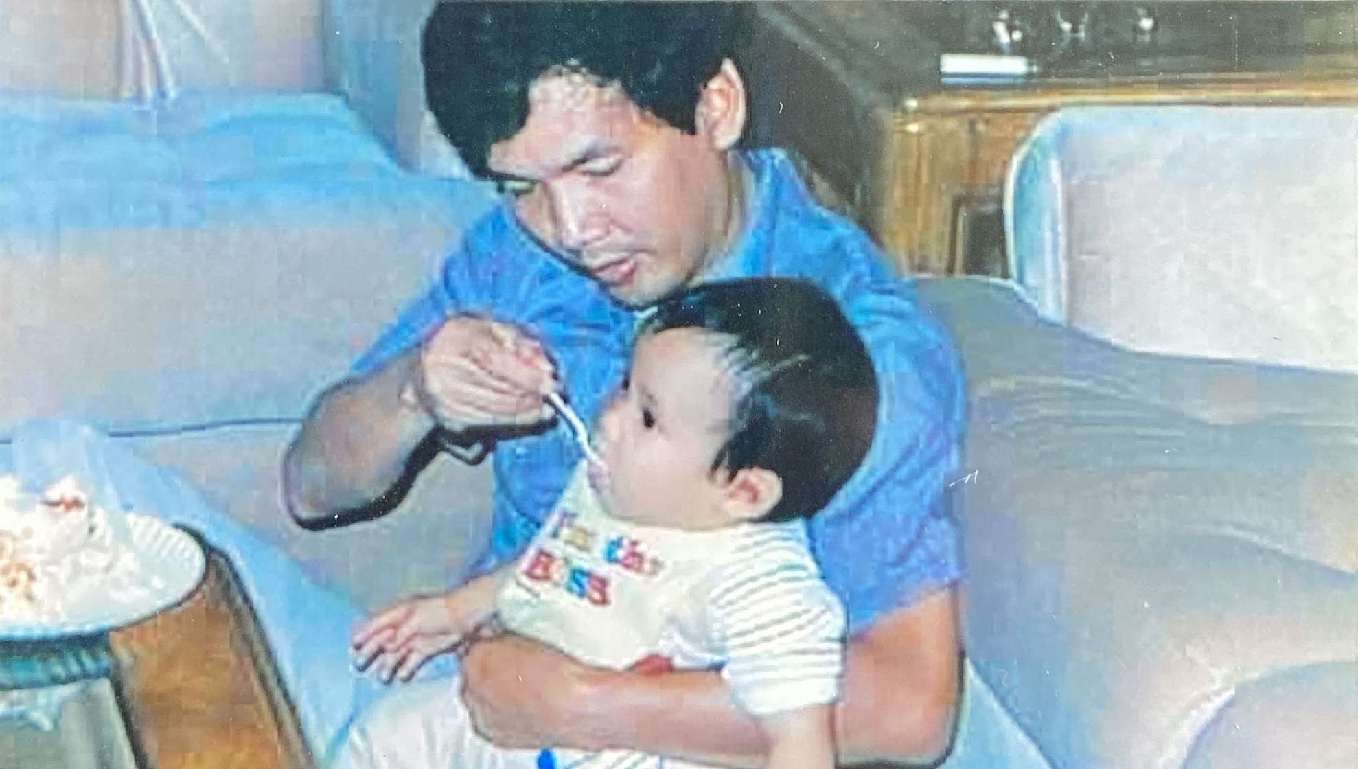 Hai Tran, M.D. holding Dave L. Tran when he was young