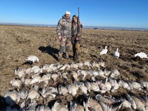 Father and son goose hunting
