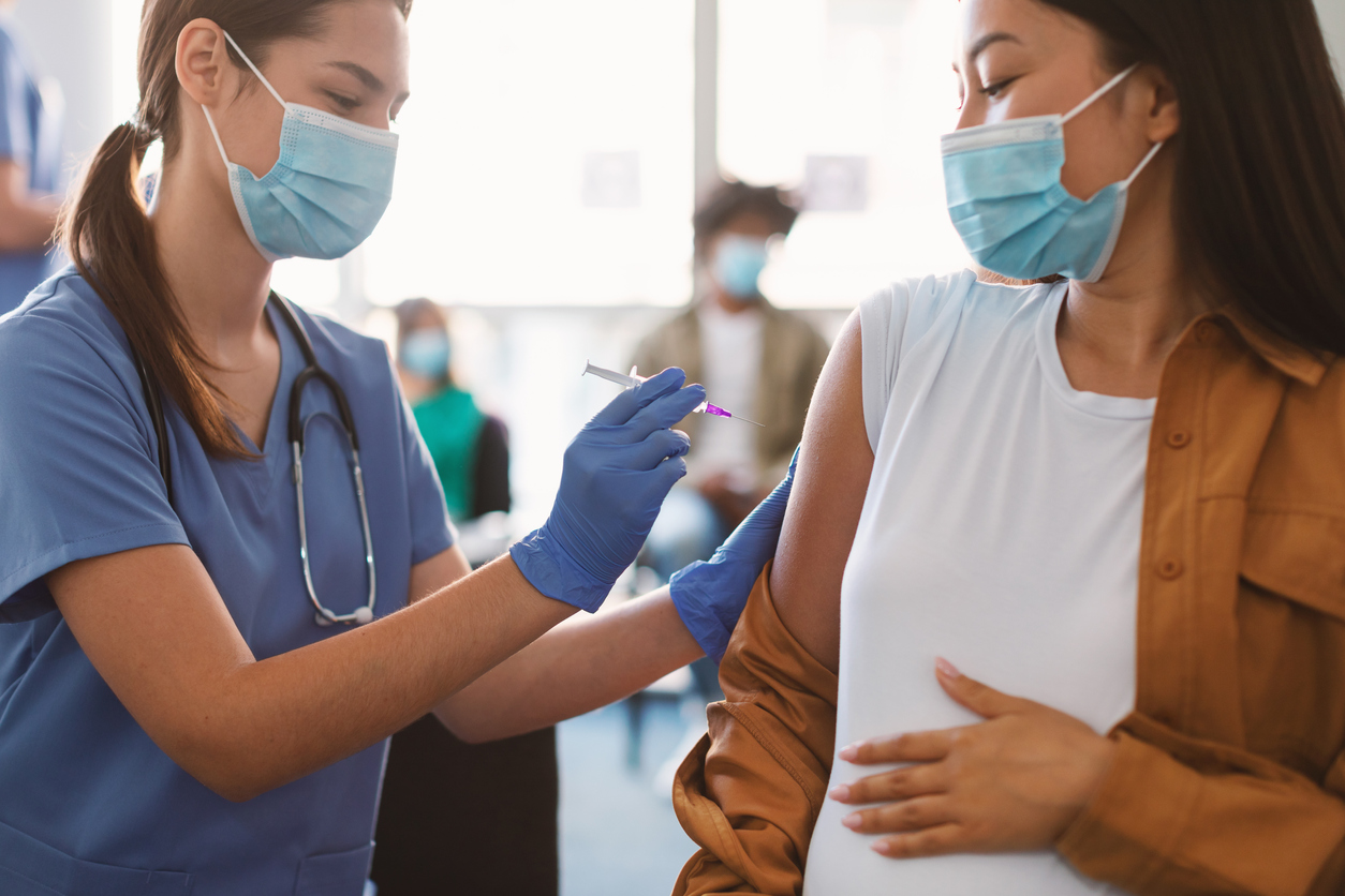 Pregnant woman getting vaccinated
