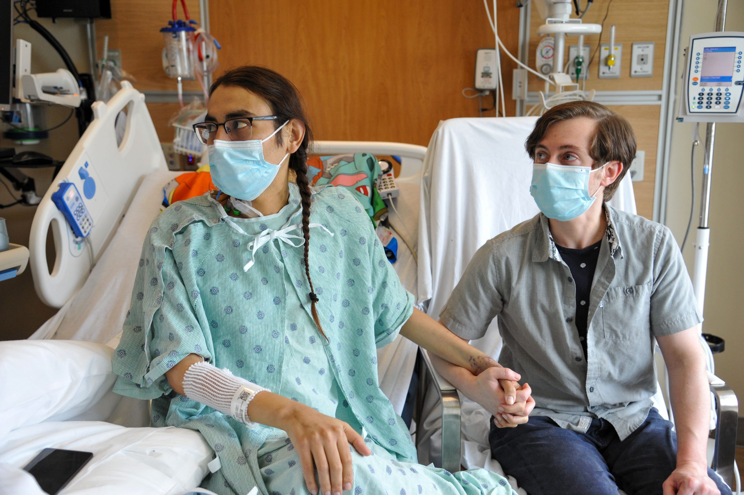 Bradley Ganoe with husband Alex Ganoe in Bradley's patient recovery room after his liver transplant surgery at CPMC