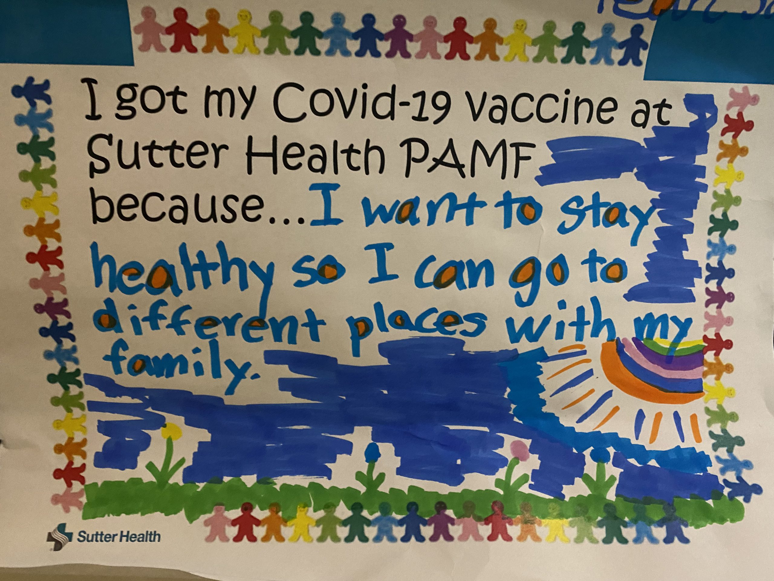 Child's colorful drawing displayed at a Sutter Health COVID vaccination clinic. It reads I got my COVID-19 vaccine at Sutter Health PAMF because...I want to stay healthy so I can go different places with my family.