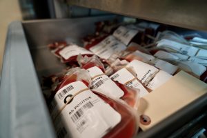 Multiple units of O blood in a hospital laboratory storage freezer.