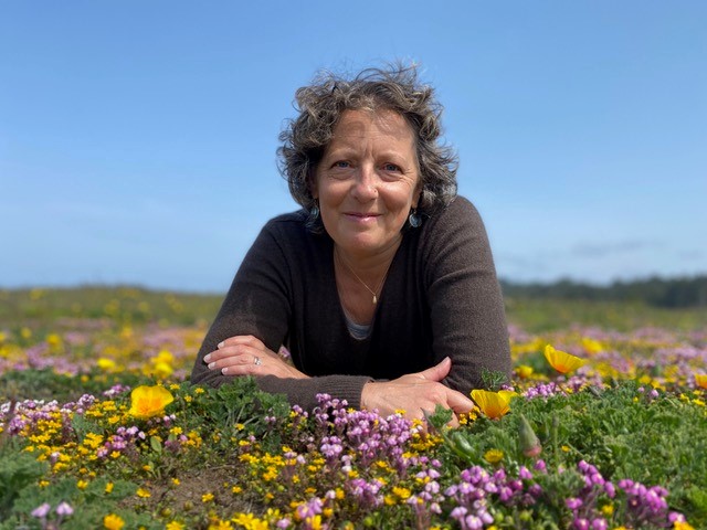 Photo of Leigh-Anne Lehrman in a flower field