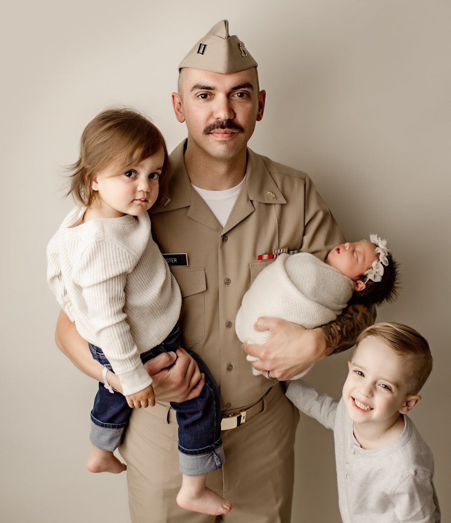 Nicholas Caster in uniform with kids