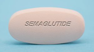 photo of a pill with the word semaglutide inscribed on it