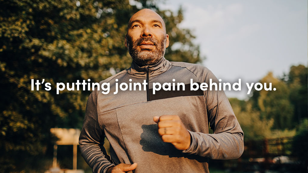 Billboard image of a man running with the words "It's putting joint pain behind you." overlayed in white text.