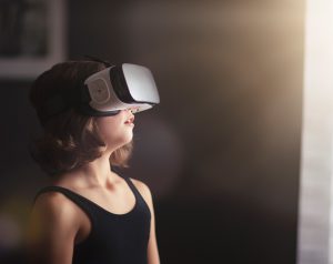 girl using VR headset