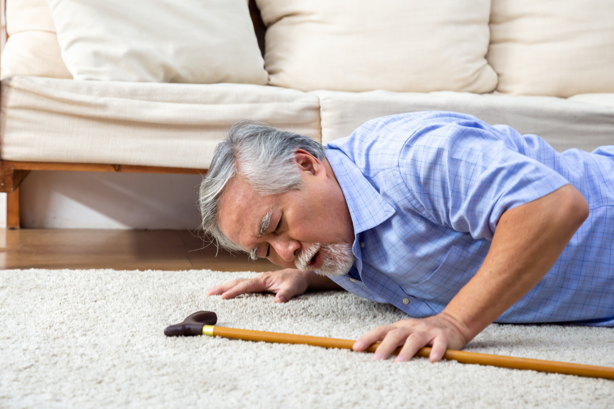 Senior man falling down at home