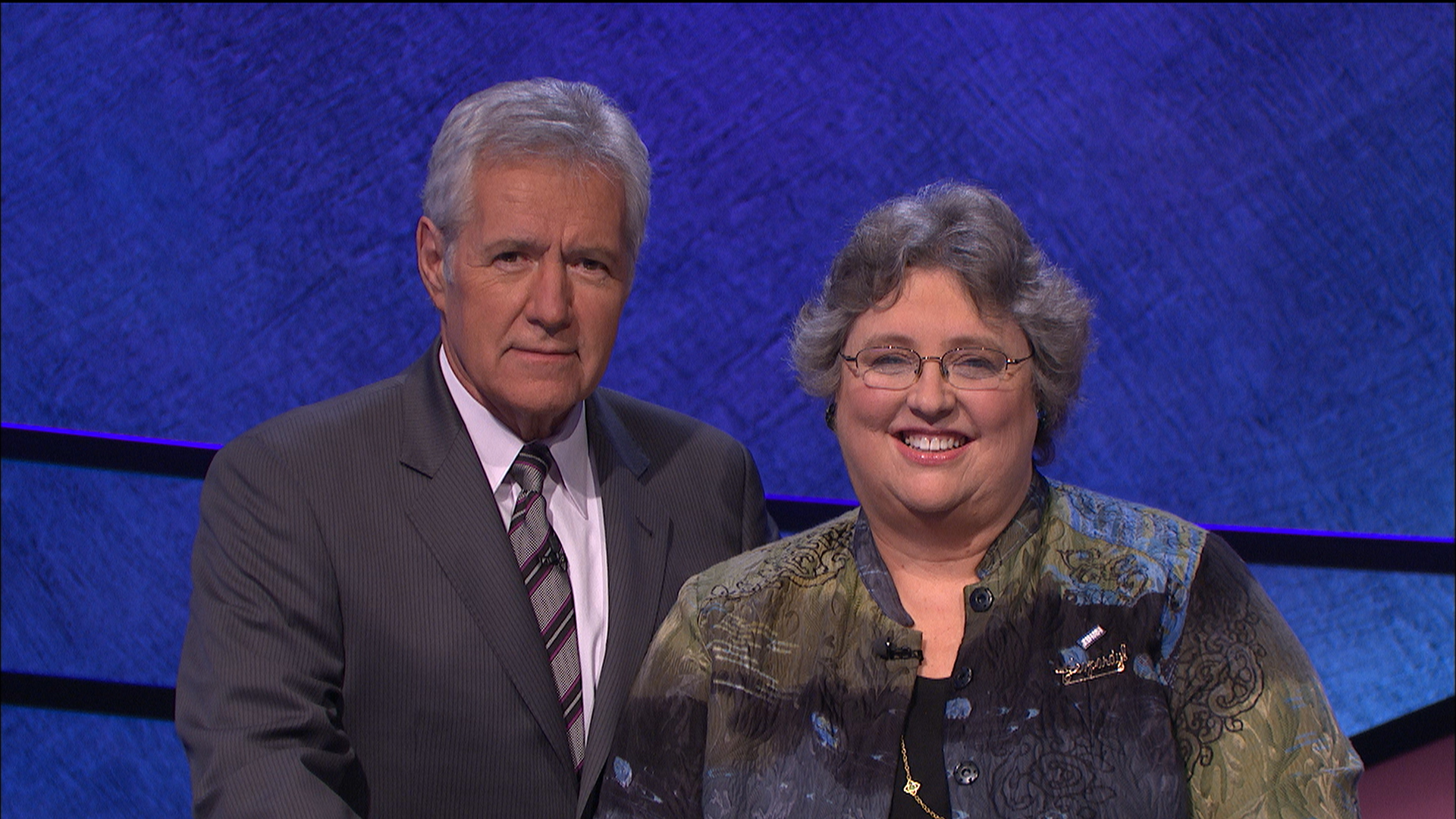 Jeopardy's Alex Trebek and winner Leslie Frates