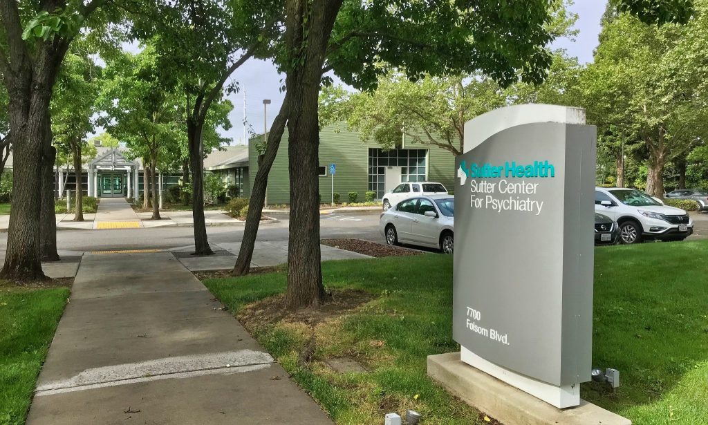 Sutter Center for Psychiatry signage with building in background
