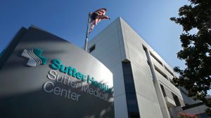 Sutter Medical Center signage with American flag
