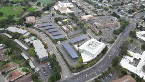 Aerial view of medical center campus with solar panel carports visible