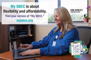 Advertisement for community college featuring Caucasian nurse with blond hair and blue scrubs sits at a table tapping onto a laptop computer