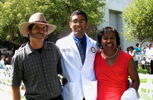 Dr. Joaquin Galarza with his mom and dad while he was in medical school.