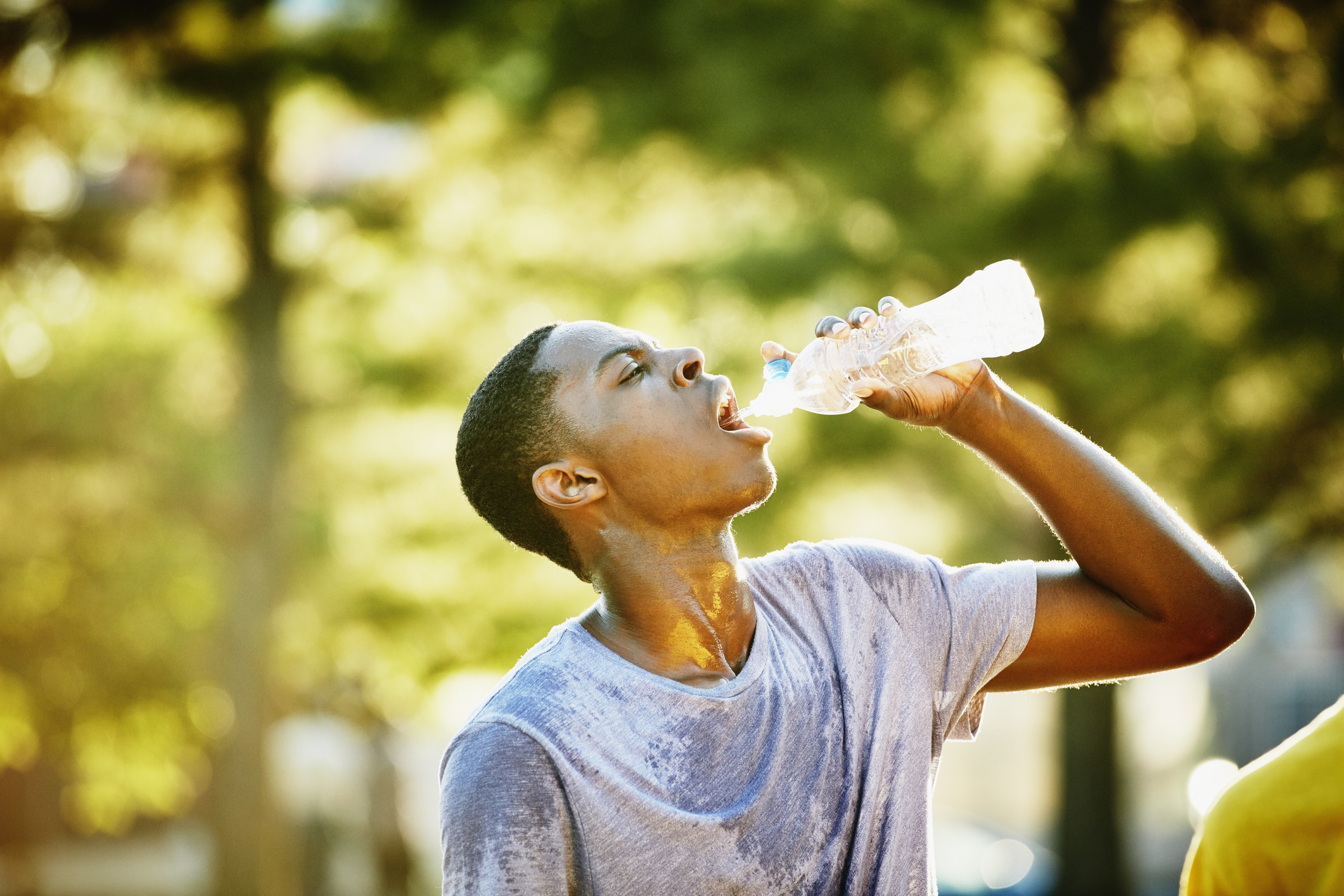 Young man drinking water