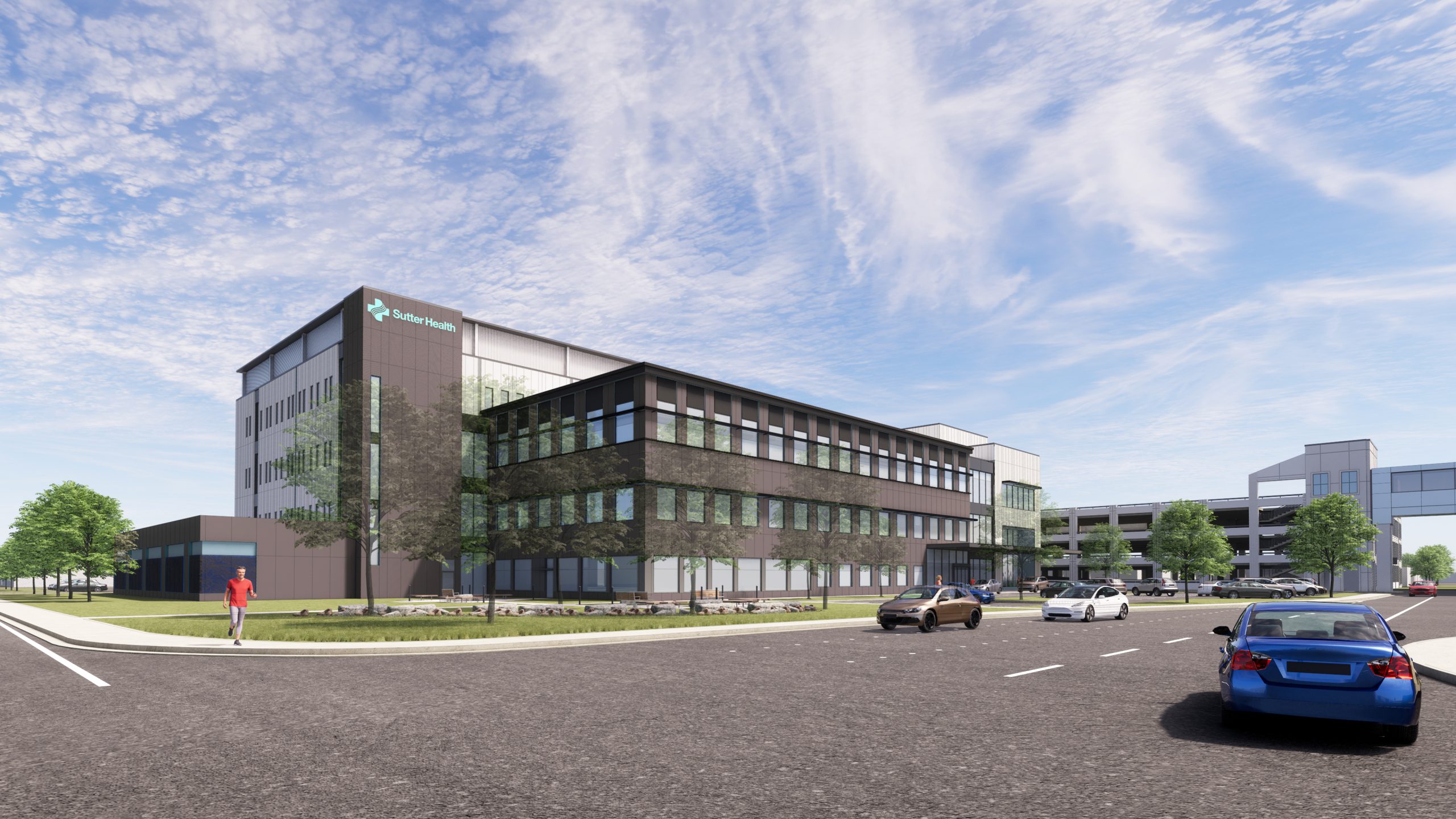 A medical office building rendering sitting behind a street as cars drive by