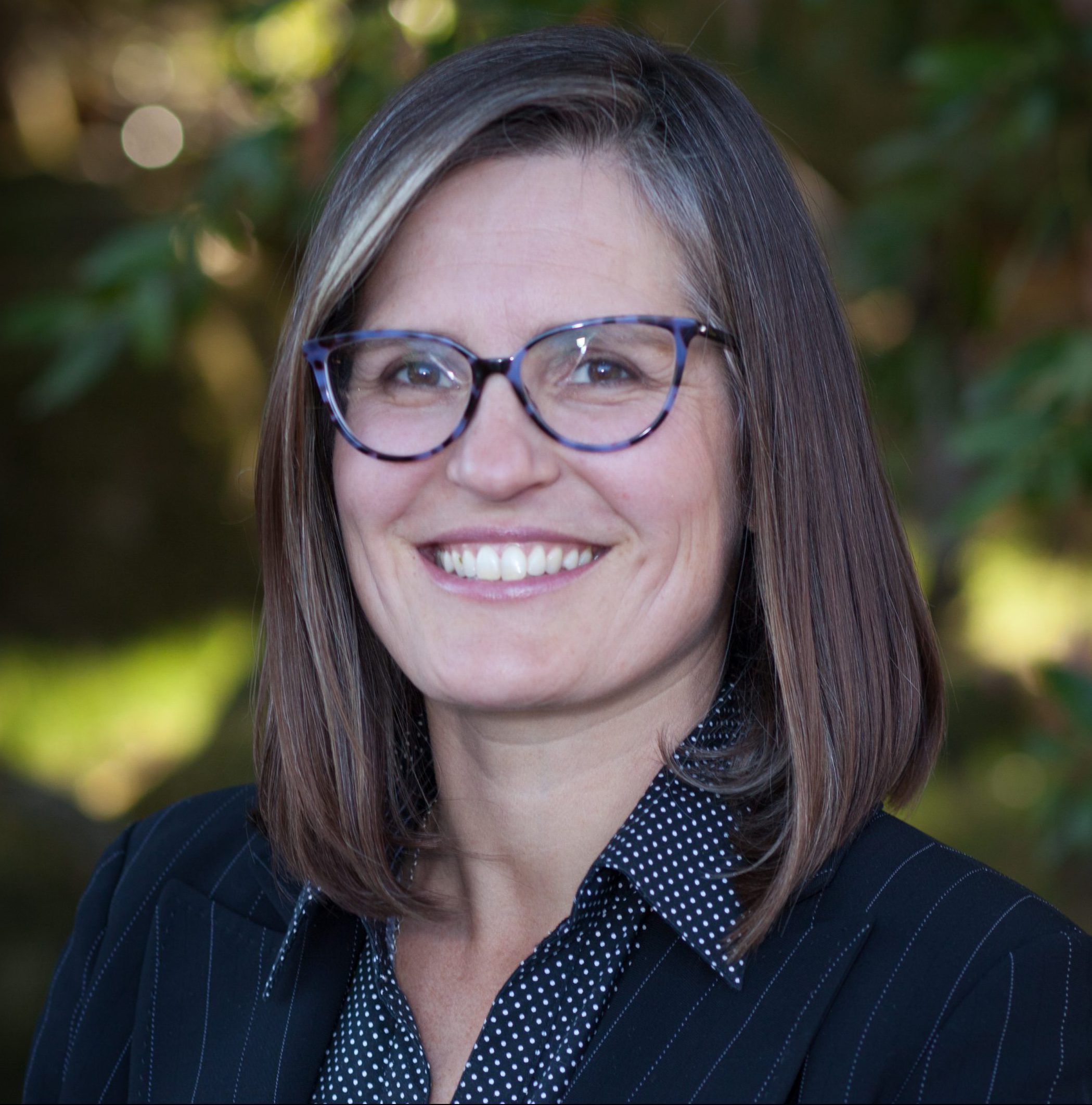 Woman with glasses and brown hair