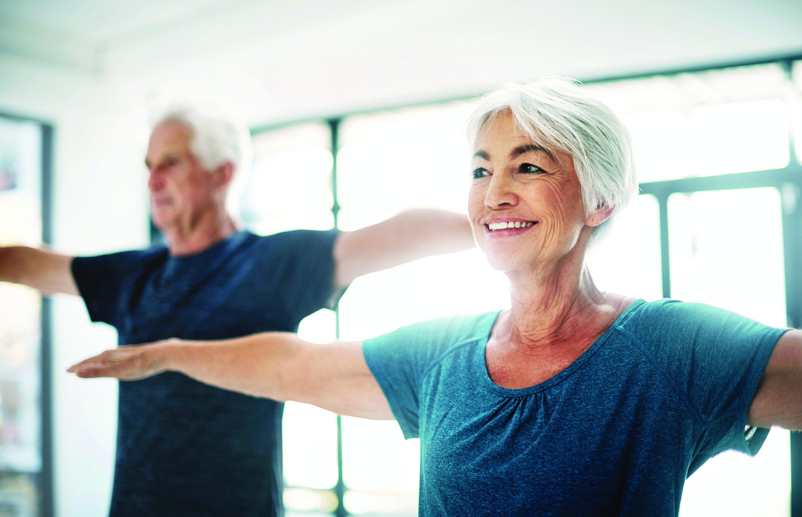 Cropped shot of a senior couple exercising together indoors