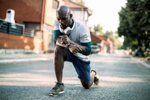 Man stretching on run