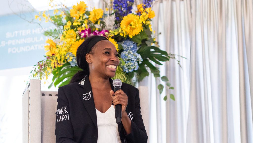 Photo of tennis star Venus Williams on stage at fundraising event for cancer services