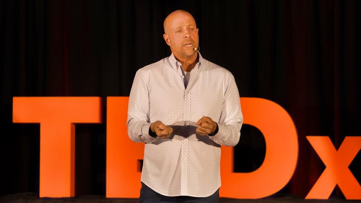 Man speaking at TED Talk