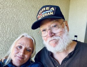 Karen Williams (Left) poses next to her dad, retired U.S. Army Staff Seargent Doug Williams