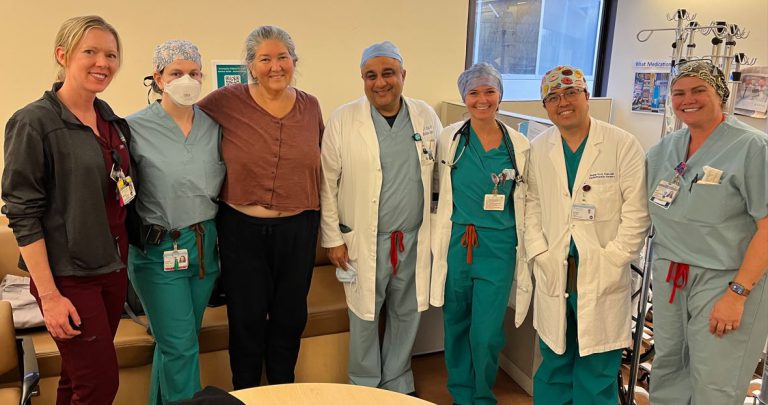 Photo of heart attack survivor, Jennifer Carothers-Liske, with her care team at Sutter Alta Bates Summit Medical Center in Oakland.