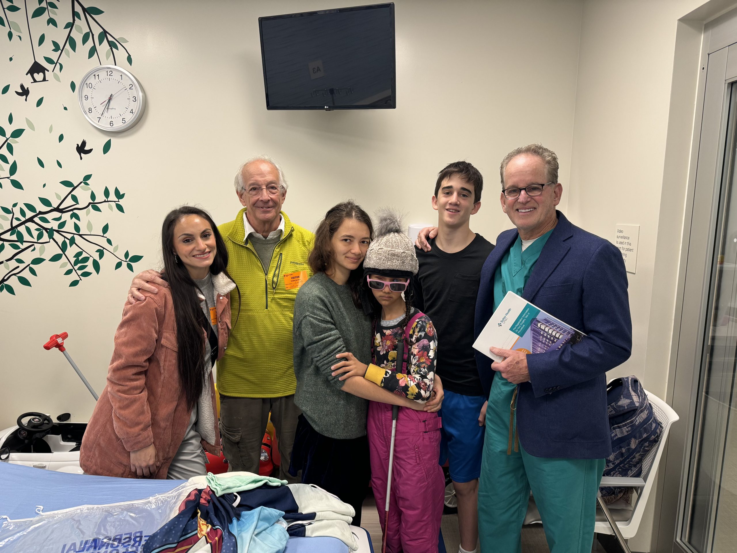 Group of people in a hospital room