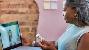 Woman having appointment with online pharmacist