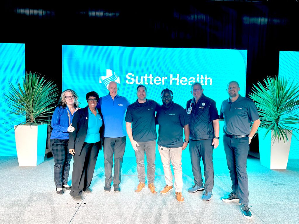 Members of the Audio and Video team pose for a photo with Sutter Health executives.