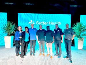 Members of the Audio and Video team pose for a photo with Sutter Health executives.