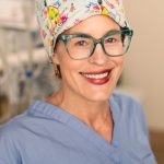 Female doctor pictured in surgery scrubs