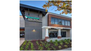 a photo of the exterior of a building housing Sutter Health care center, with Sutter logo displayed