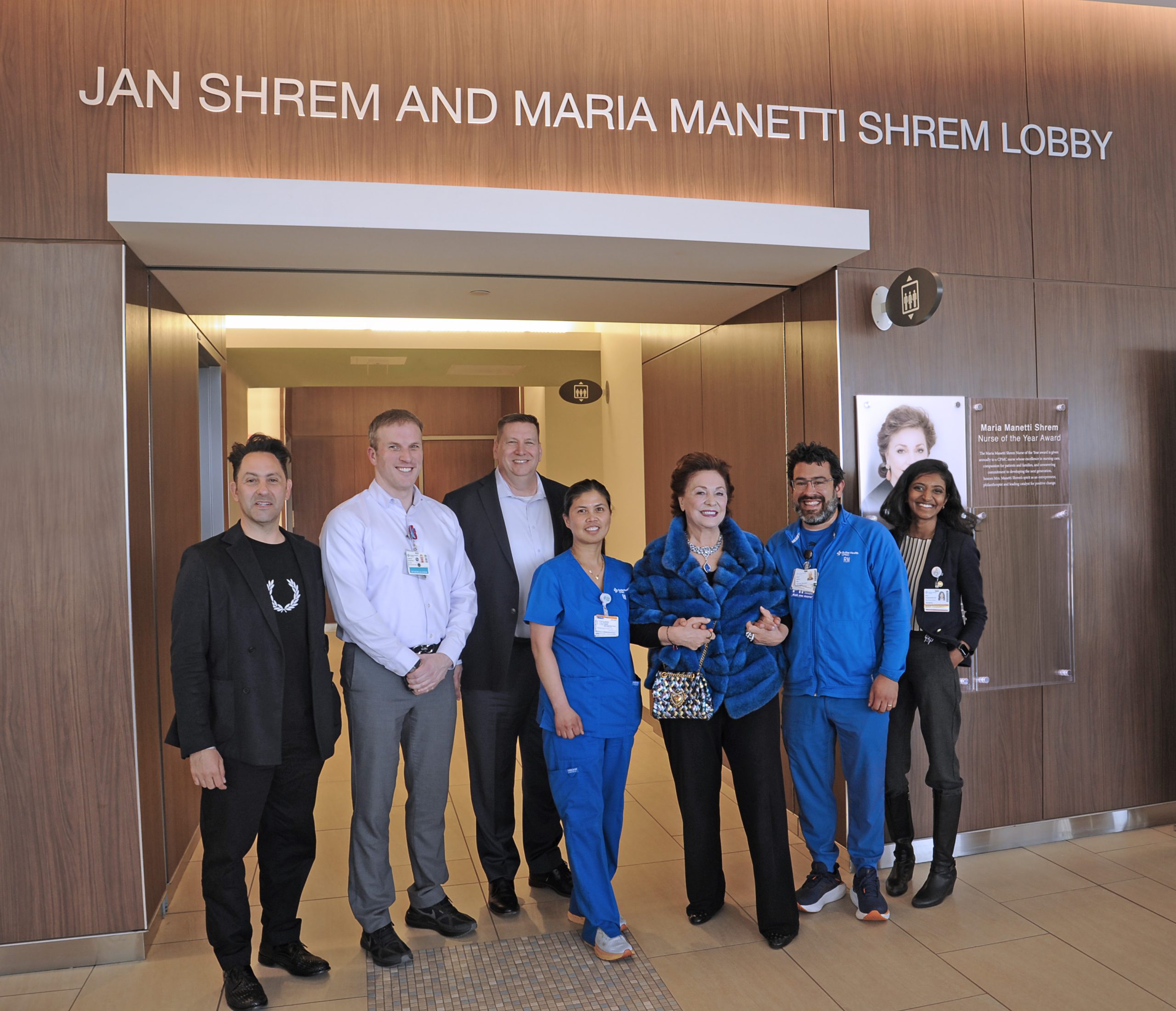 Maria Manetti Shrem with two CPMC nurses and group of people