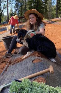 Cayla and her dog, Bailey, helping on the family's lavender farm.