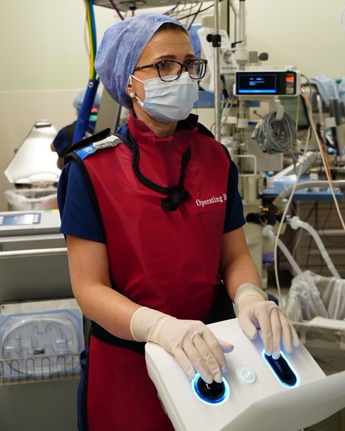 A surgeon uses robotic technology