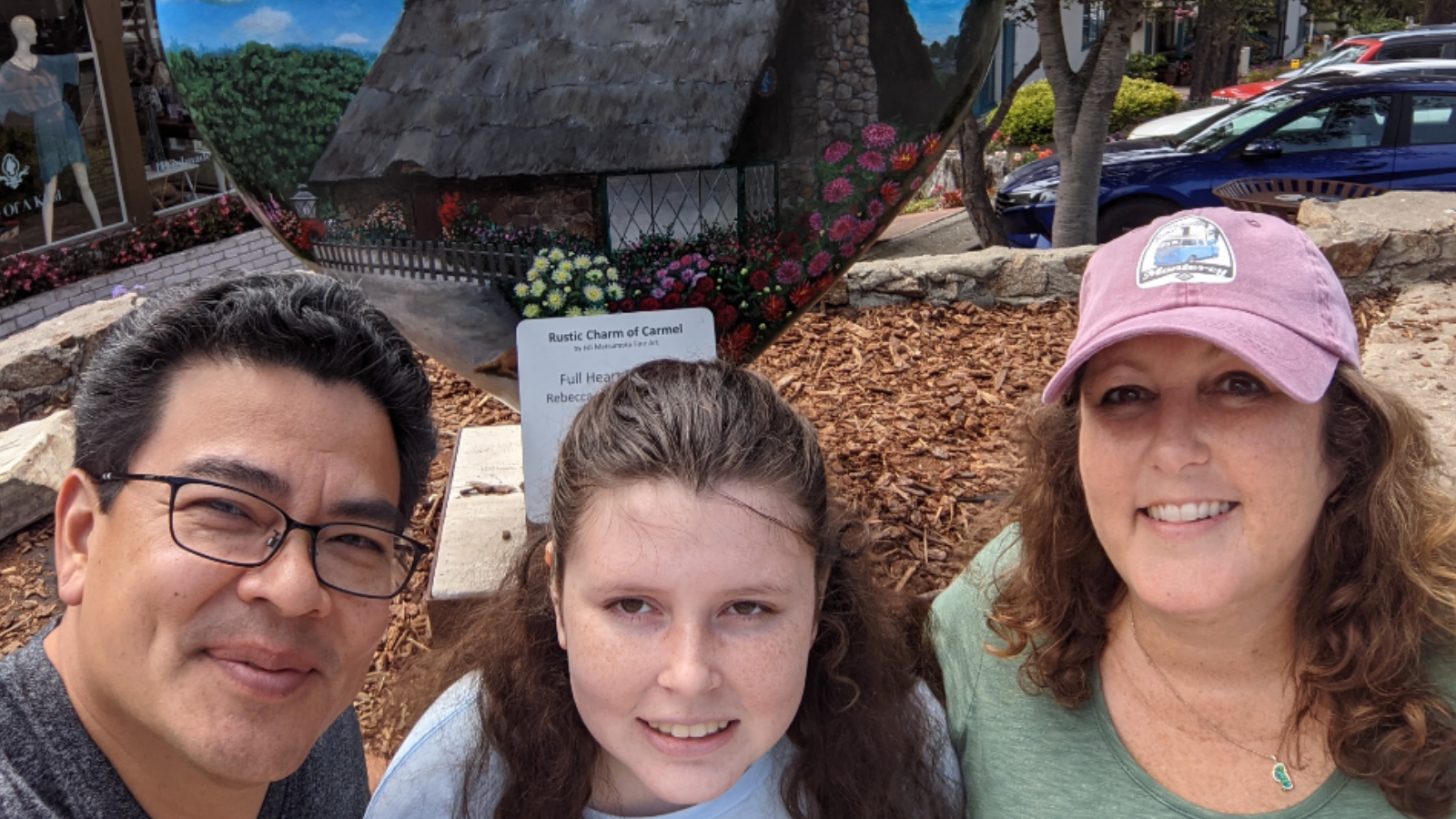 Left to right: Rico, Cayla and Carrie in front of mirrored heart statue in Carmel, California.